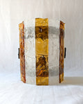 A vintage mid century modern 1970s Carlo Nason for Mazzega rectangular wall sconce with textured amber and clear striped Murano glass panels on white linen surface.